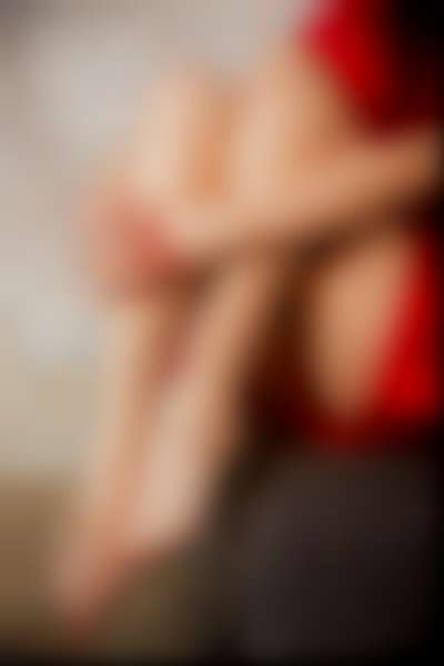 elegant female feet on a sofa